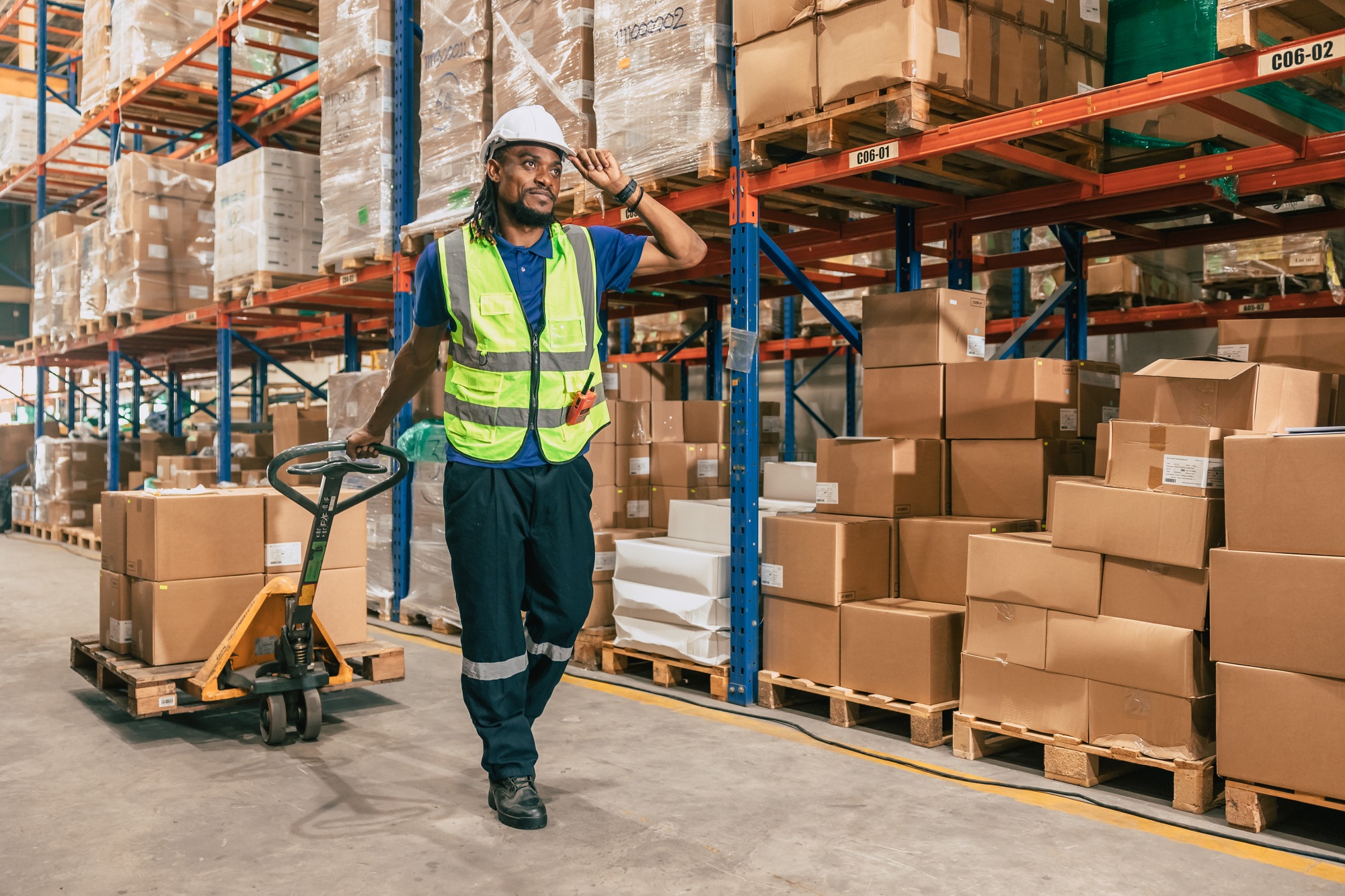 warehouse worker using parcel pallet in cargo shipping logistics ship supply management