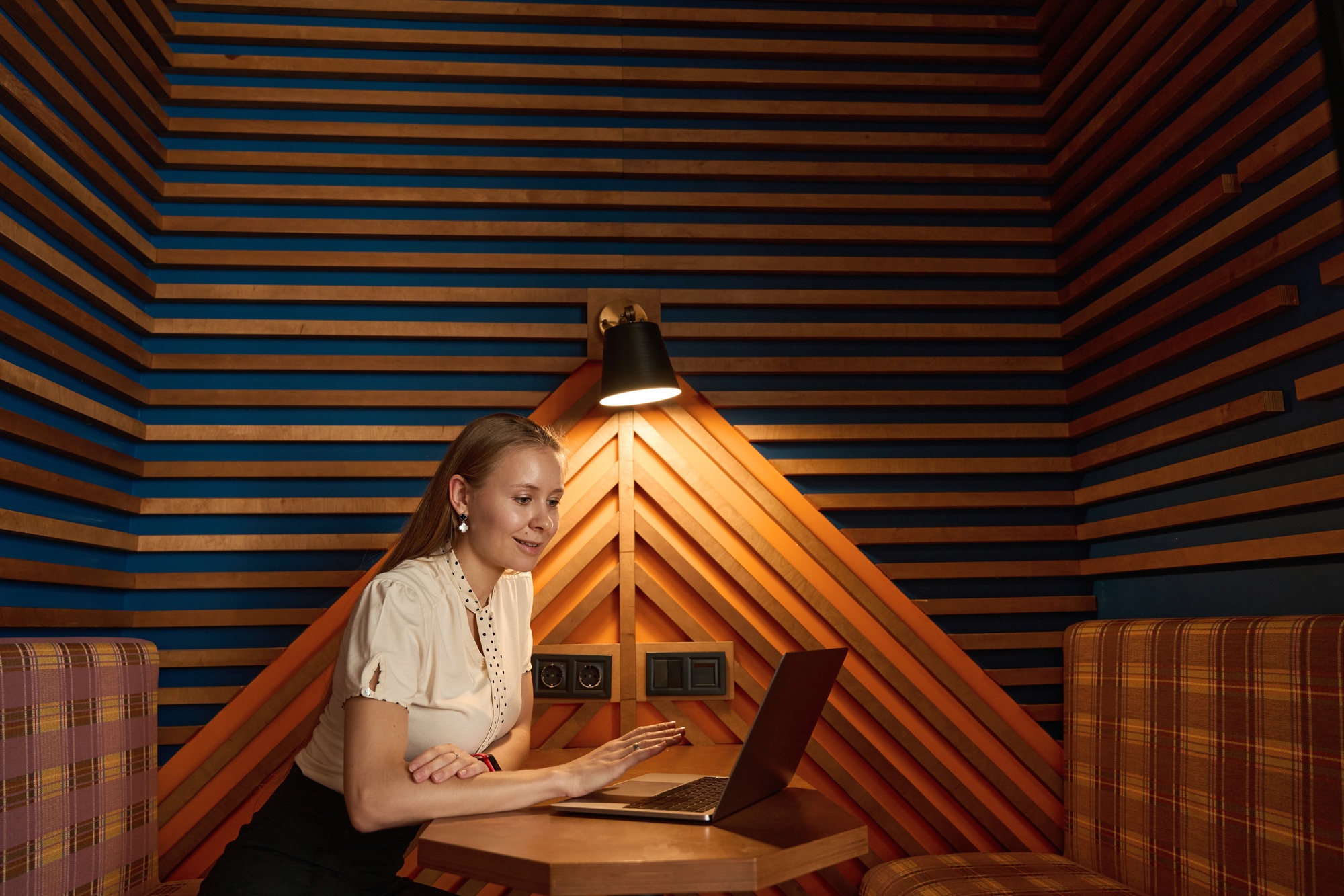 Woman is fascinated by the remote workflow through the computer