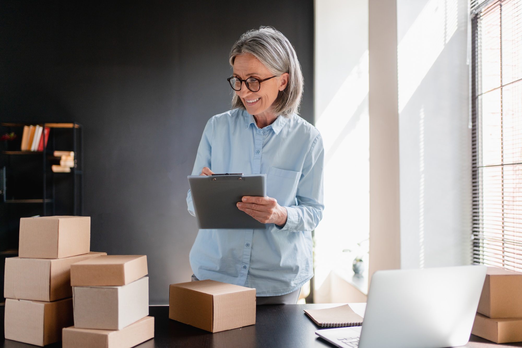 Woman, tablet and checklist for small business, ecommerce and boutique startup with online sales.