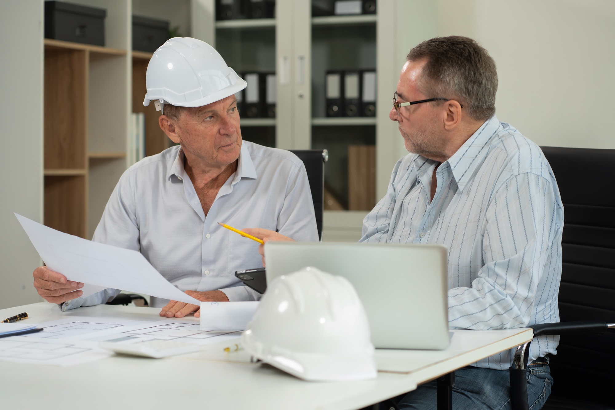 architect working on table use drawing tool on the paper plan for business architectural project.
