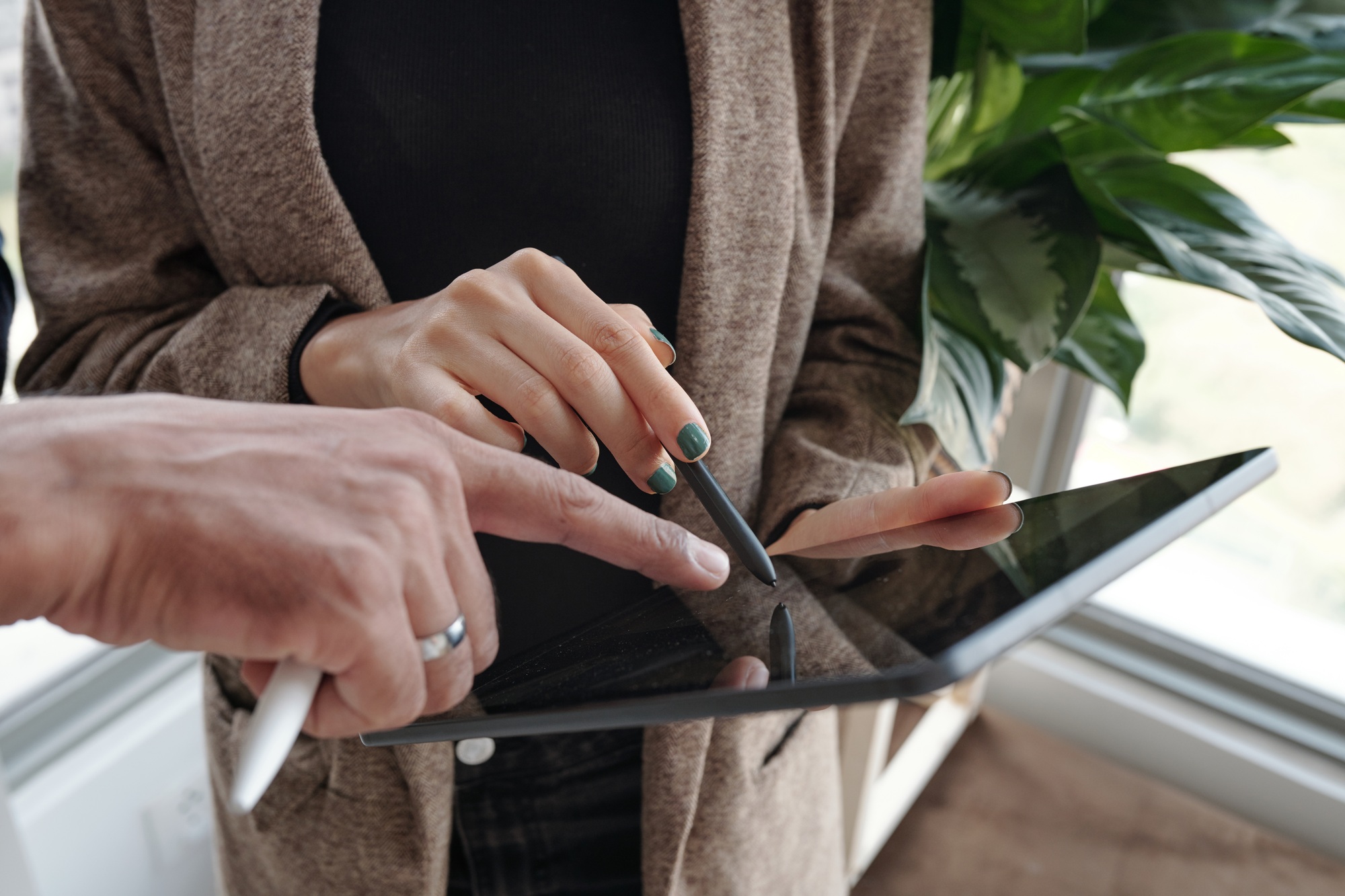 Business People Choosing Logo on Tablet