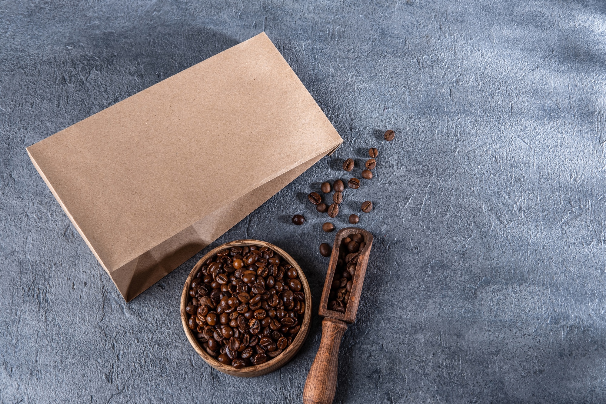 Coffee identity branding mockup. Blank brown craft bag with coffee beans.