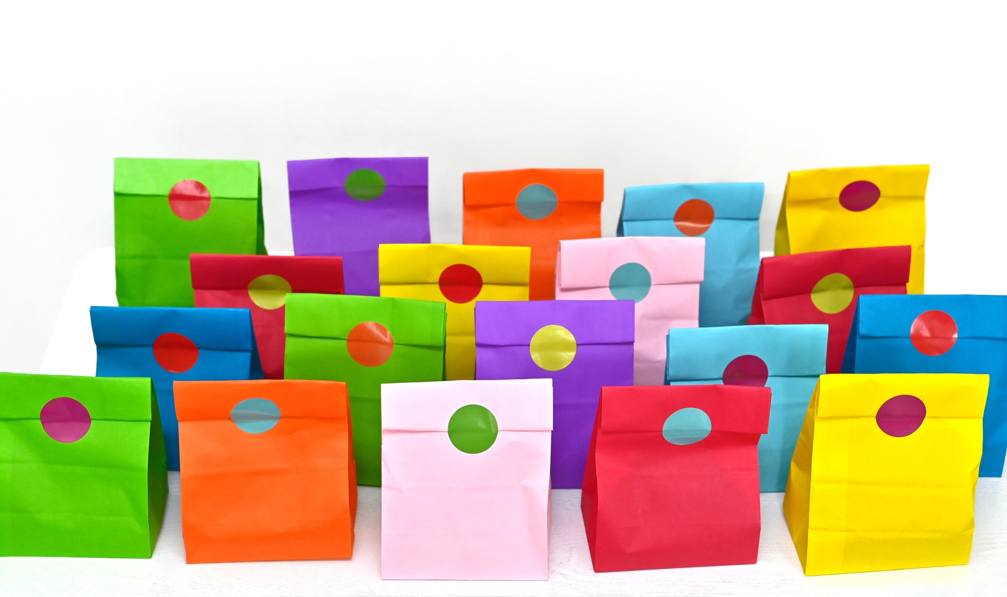Colorful shopping folded paper bags mockup. Mock up for branding and corporate identity design.