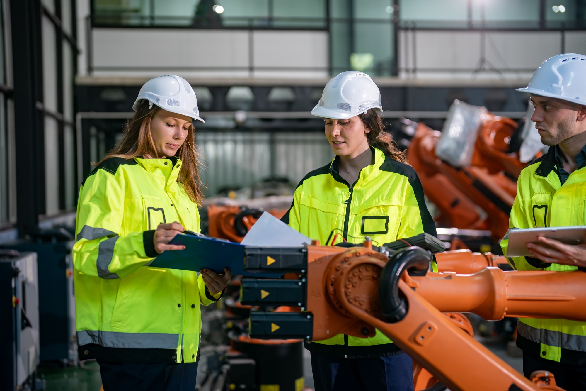 Engineers Collaborate on Robotic Assembly Operations in a High-Tech Facility