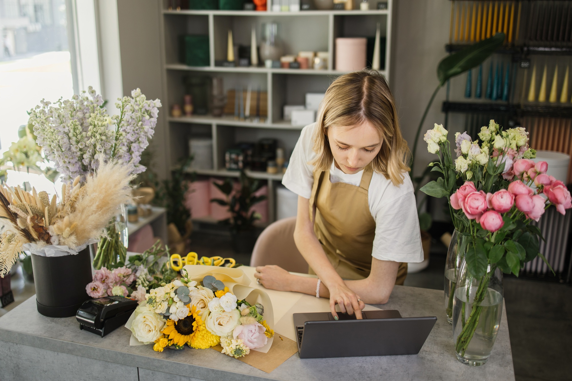 Woman florist discusses the order by talking on video call.